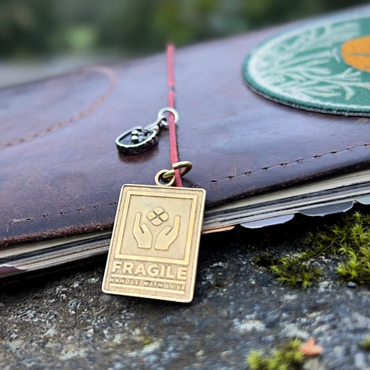 "Fragile" Brass Charm