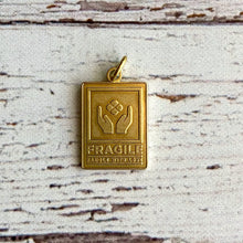 Load image into Gallery viewer, &quot;Fragile&quot; Brass Charm
